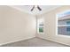 Comfortable bedroom featuring two windows letting in natural light and plush carpeting at 10316 Hebblewhite, Englewood, FL 34223