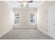 Comfortable bedroom with two windows letting in natural light and plush carpeting at 10316 Hebblewhite, Englewood, FL 34223