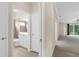 Bright interior with tile flooring leading to the living area, with a view of the bathroom at 10316 Hebblewhite, Englewood, FL 34223