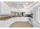 Well-equipped kitchen with white cabinets, granite countertops, and stainless steel appliances at 10316 Hebblewhite, Englewood, FL 34223