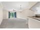 Spacious living room with sliding glass doors leading to the outside and stylish chandelier at 10316 Hebblewhite, Englewood, FL 34223