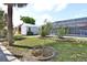 The backyard has a screened-in pool, patio, a shed, and beautiful landscaping, creating a relaxing outdoor space at 107 Sinclair Se St, Port Charlotte, FL 33952
