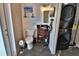 Bathroom and Laundry Room featuring dark wood vanity, granite countertop, and a stacked washer and dryer at 107 Sinclair Se St, Port Charlotte, FL 33952