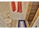 Modern bathroom with a walk-in shower, toilet, wood look tile and wall accents at 107 Sinclair Se St, Port Charlotte, FL 33952
