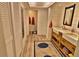 Spacious bathroom with double sink vanity, ample storage and mirrors at 107 Sinclair Se St, Port Charlotte, FL 33952