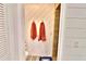 Modern bathroom with walk-in shower and towel hooks on the wall at 107 Sinclair Se St, Port Charlotte, FL 33952