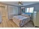 Well-appointed bedroom featuring a lighted headboard, closet, and modern furnishings at 107 Sinclair Se St, Port Charlotte, FL 33952