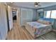 Cozy bedroom with stylish decor, featuring a lighted headboard and ample closet space at 107 Sinclair Se St, Port Charlotte, FL 33952