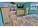 Bright bedroom with a view through to other rooms, showcasing a dresser and stylish decor at 107 Sinclair Se St, Port Charlotte, FL 33952