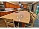 Well-lit kitchen featuring a large island with pendant lighting, stainless steel appliances, and tile flooring at 107 Sinclair Se St, Port Charlotte, FL 33952