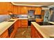 Well-equipped kitchen with stainless steel appliances, stone countertops, and ample storage space at 107 Sinclair Se St, Port Charlotte, FL 33952