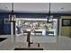 Kitchen with views to the lanai, featuring a large island, stainless appliances and sink at 107 Sinclair Se St, Port Charlotte, FL 33952