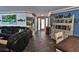 Living room with slate floors, coastal decor, and a sliding barn door at 107 Sinclair Se St, Port Charlotte, FL 33952