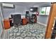 Functional home office with multiple monitors, ample workspace, and comfortable seating at 107 Sinclair Se St, Port Charlotte, FL 33952
