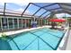 Spacious pool area featuring a large pool and ample seating, great for outdoor gatherings at 107 Sinclair Se St, Port Charlotte, FL 33952