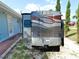 Designated RV parking area beside the house with a convenient hookup, ideal for travelers at 107 Sinclair Se St, Port Charlotte, FL 33952