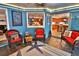 Sunroom with slate floors and a view into the kitchen at 107 Sinclair Se St, Port Charlotte, FL 33952