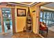 Unique boat-shaped wine rack beside an indoor pool area filled with natural light in a stylish setting at 107 Sinclair Se St, Port Charlotte, FL 33952