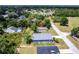 Aerial view of a home in a suburban setting, showcasing its location and surrounding greenery at 14179 Massey Ave, Port Charlotte, FL 33953