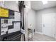 Utility room with energy-efficient HVAC system, sink, and ample space at 14179 Massey Ave, Port Charlotte, FL 33953