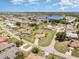 Aerial view of a charming home in a residential neighborhood with a nearby lake at 1472 Oriel Ct, Punta Gorda, FL 33983
