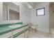 Bright bathroom featuring a single sink, a large mirror, and a toilet near the window at 1472 Oriel Ct, Punta Gorda, FL 33983