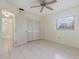Bedroom with tile flooring, closet, and a window providing natural light at 1472 Oriel Ct, Punta Gorda, FL 33983