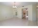 Bright living room with tile flooring, ceiling fan, and adjacent kitchen view at 1472 Oriel Ct, Punta Gorda, FL 33983