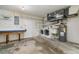 Spacious utility room with washer, dryer, water heater and workbench at 1472 Oriel Ct, Punta Gorda, FL 33983