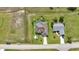 Aerial view of an outdoor pool surrounded by manicured landscaping and mature palms at 1499 Nuremberg Blvd, Punta Gorda, FL 33983