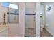 Beautiful bathroom featuring a glass enclosed shower and toilet with beach themed decor at 1499 Nuremberg Blvd, Punta Gorda, FL 33983