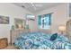 Comfortable bedroom with beach themed decor and a ceiling fan at 1499 Nuremberg Blvd, Punta Gorda, FL 33983