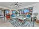 Living room with a large sectional sofa and view of the yard at 1499 Nuremberg Blvd, Punta Gorda, FL 33983