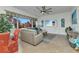 Living room with a beige sectional sofa and view of the yard at 1499 Nuremberg Blvd, Punta Gorda, FL 33983