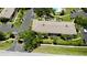Aerial view of well maintained complex with landscaping, a pool, and convenient parking at 1515 Forrest Nelson Blvd # D102, Port Charlotte, FL 33952