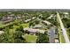 Aerial view of condo community showing lush landscaping, well-maintained buildings and convenient parking areas at 1515 Forrest Nelson Blvd # D102, Port Charlotte, FL 33952