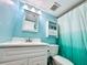 Cozy bathroom boasts a vanity with white cabinets, and an updated sink fixture at 1515 Forrest Nelson Blvd # D102, Port Charlotte, FL 33952