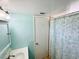 Bathroom featuring blue walls, updated vanity and shower/tub at 1515 Forrest Nelson Blvd # D102, Port Charlotte, FL 33952