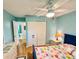 Bedroom with light blue walls, wooden floors, and ensuite bathroom at 1515 Forrest Nelson Blvd # D102, Port Charlotte, FL 33952