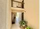 Hallway with multiple doors and a view of the outdoors, showing a well-lit and accessible entrance to units at 1515 Forrest Nelson Blvd # D102, Port Charlotte, FL 33952