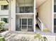 Screened patio offers an outdoor living space, accessible from a courtyard with landscaped ground at 1515 Forrest Nelson Blvd # D102, Port Charlotte, FL 33952