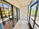Enclosed lanai with tile flooring and screens, providing a private outdoor space with natural light at 1515 Forrest Nelson Blvd # D102, Port Charlotte, FL 33952