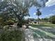 Community shuffleboard court with ample seating and landscaping; a serene spot for outdoor recreation at 1515 Forrest Nelson Blvd # D102, Port Charlotte, FL 33952