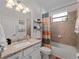 Bathroom featuring a vanity with granite countertop, a toilet, and a bathtub with a shower at 15974 Clear Skies Pl, Bradenton, FL 34211