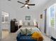Bedroom featuring a bed, dresser, and a seating area at 15974 Clear Skies Pl, Bradenton, FL 34211