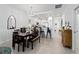 Dining area with a modern chandelier, and view into the kitchen and hallway at 15974 Clear Skies Pl, Bradenton, FL 34211