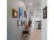 Hallway with tile floors, recessed lighting, and decorative wall hangings at 15974 Clear Skies Pl, Bradenton, FL 34211