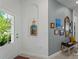 Bright hallway featuring tiled floors, wall decorations, and an arched niche at 15974 Clear Skies Pl, Bradenton, FL 34211