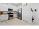 Kitchen with stainless steel appliances, white cabinets and stone counter tops at 15974 Clear Skies Pl, Bradenton, FL 34211