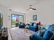 Inviting living room featuring outdoor view through the glass doors to the patio at 15974 Clear Skies Pl, Bradenton, FL 34211